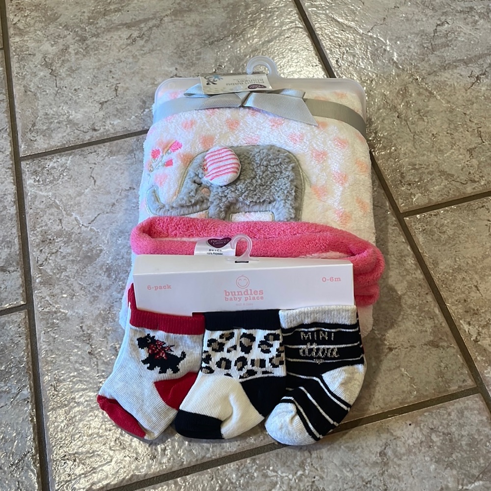 Plush baby blanket and baby socks.